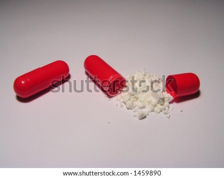 three red pills, one opened