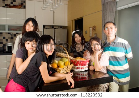 Asian family at the kitchen