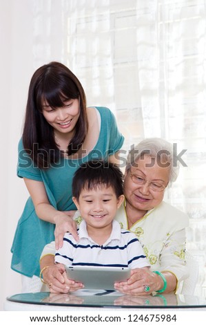 Three generations family having fun on the internet