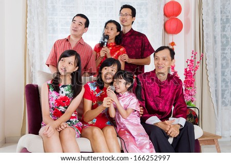 Chinese family singing Karaoke