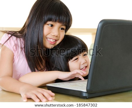 Asian kids using laptop Asian kids using laptop