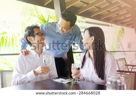 Asian business team having discussion in the restaurant