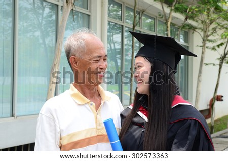 Asian university graduate and father