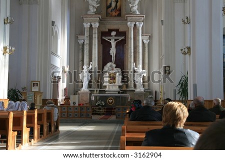 Old church interior with pews and ornate columns