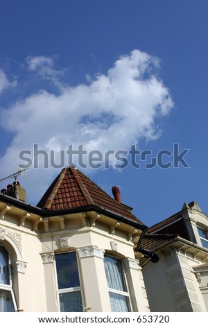 A rich, blue sky above some houses.