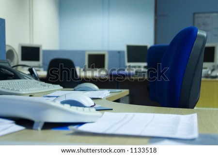 Focus on a single desk in an empty office