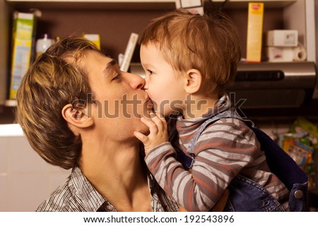 son kissing his father