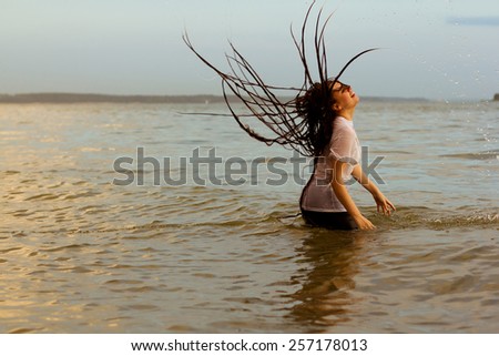 Water motion freeze woman in sunrise bathing