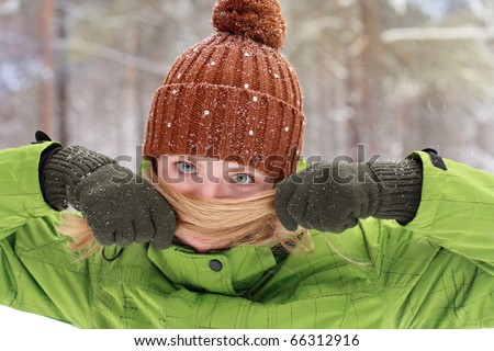 beautiful girl covers a nose from a cold with hair