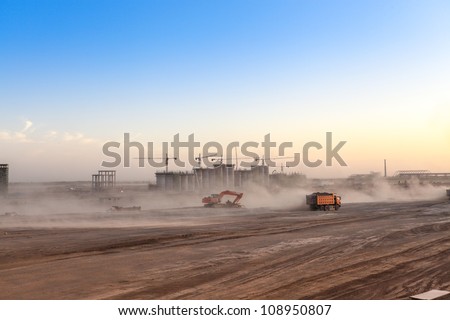 busy construction site at dusk,the dust was blowing