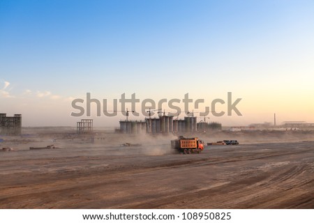 busy construction site at dusk,the dust was blowing