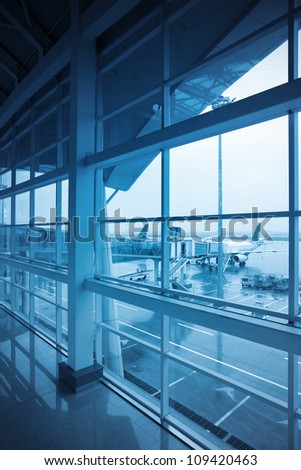 airport window outside with blue tone