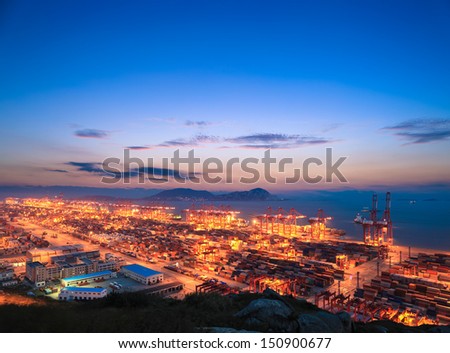 container terminal with sunset glow in shanghai east China sea