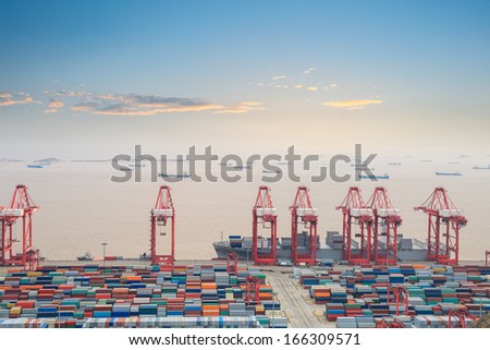 container terminal with sunset glow in shanghai east China sea