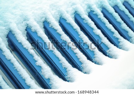 snow covered with solar water heater in winter