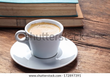 coffee and books on the old wooden table