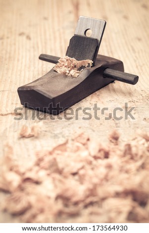 small wood planer and shavings closeup,carpentry concept background