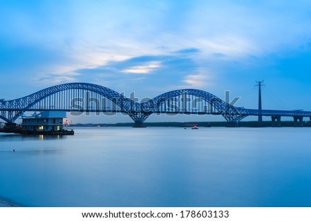 nanjing dashengguan yangtze river bridge at dusk, is the world\'s largest design load high speed railway bridge,China.