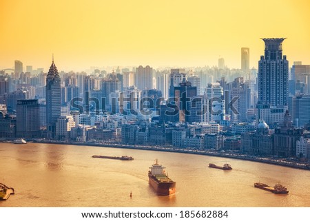 modern city at dusk in shanghai ,a bird\'s eye view of huangpu river and the bund