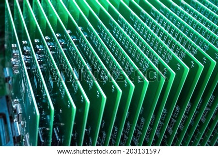 green communication circuit board closeup in a server room