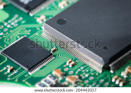 processor with green electronic circuit board closeup ,abstract technology background