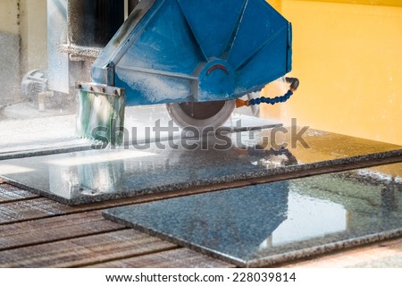 stone cutting closeup ,granite sawing machine in a factory