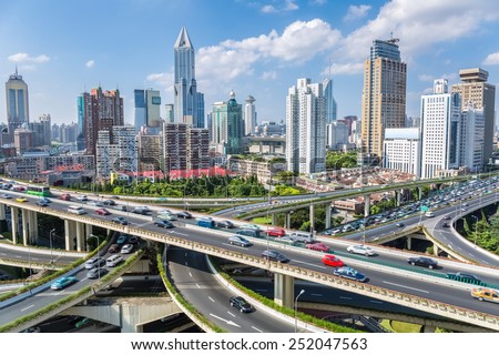 shanghai highway overpass with modern city skyline against a sunny sky