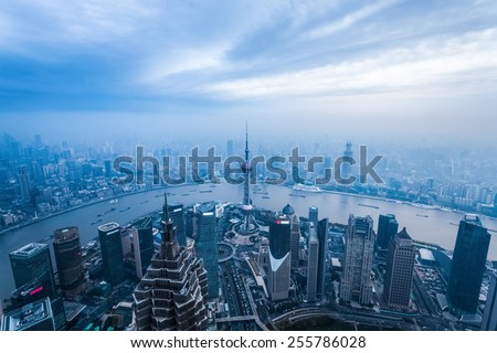 a bird\'s eye view of magic city of shanghai at dusk