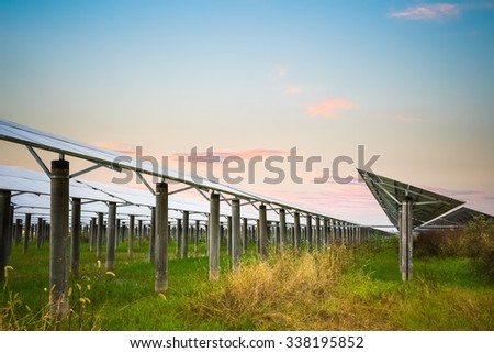 solar farm with sunset glow,  clean energy in autumn