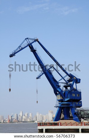 cargo cranes against blue sky