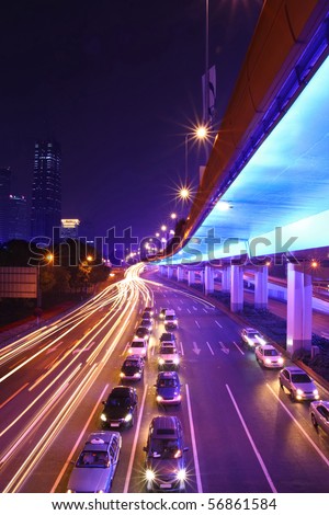 light traces from moving cars and wait for the passage of cars at highway in night ,shanghai,china
