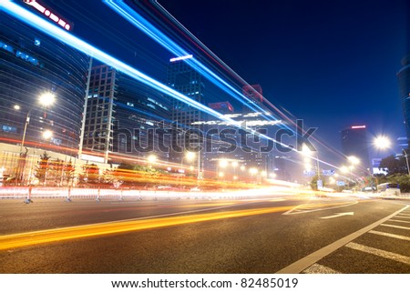 light trails on the street in beijing central business district,China