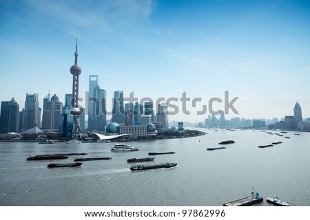 shanghai pudong skyline and busy huangpu river shanghai pudong skyline and busy huangpu river