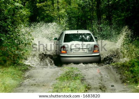 Rally car splashing the water
