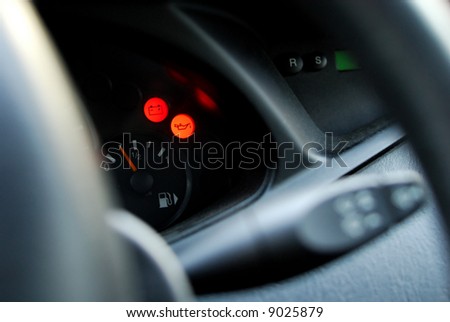 Closeup of car dashboard, with red light controls