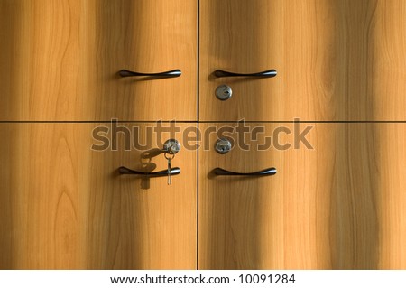 Closeup on wooden office cabinet warmly lighted