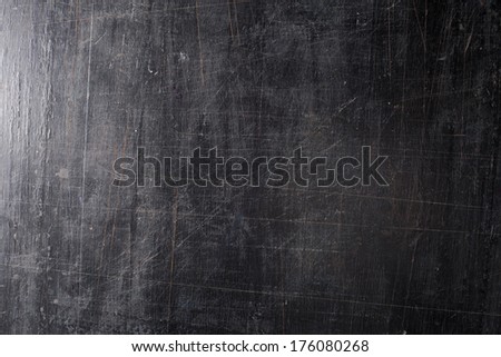 The black scratched background. board.