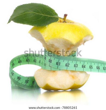 Green apple with measurement. A narrow waist. A harmonous figure.