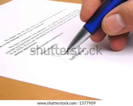 Staff manager signing a letter in response to a job application