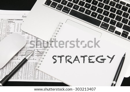 To Do List on notepad. Background of Working Table with Laptop, Pens, Mouse. Business Concept.