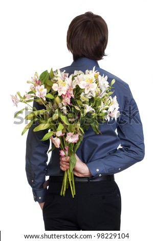 http://image.shutterstock.com/display_pic_with_logo/519100/98229104/stock-photo-man-hold-bouquet-of-flowers-behind-his-back-isolated-on-white-background-98229104.jpg