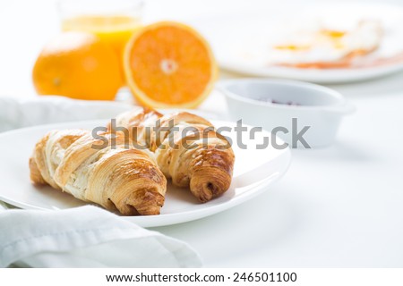 delicious breakfast with croissants and juice