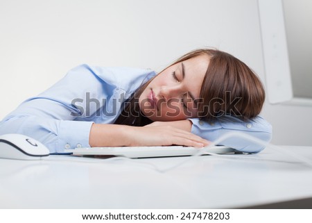 Beautiful woman tired at work