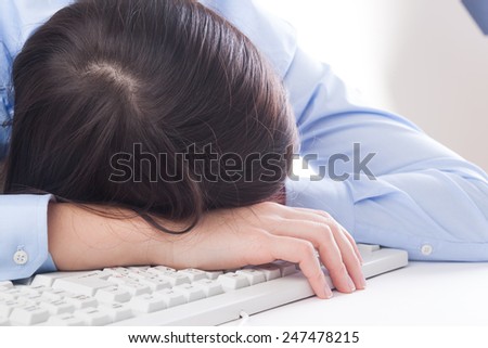 Young woman sleep at work