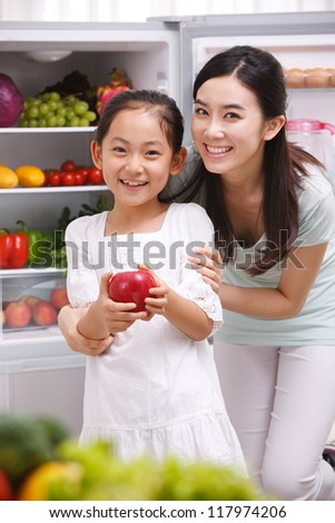 mother and daughter in kitchen