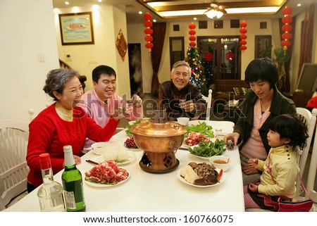 A shot of Chinese family at dinner table