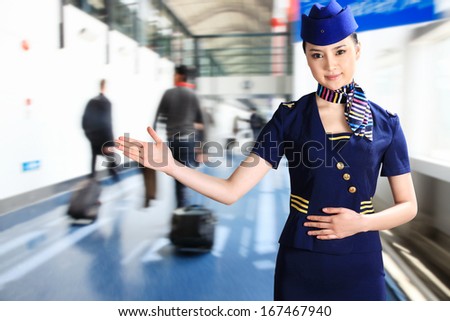 A shot of Flight attendant making hand gesture