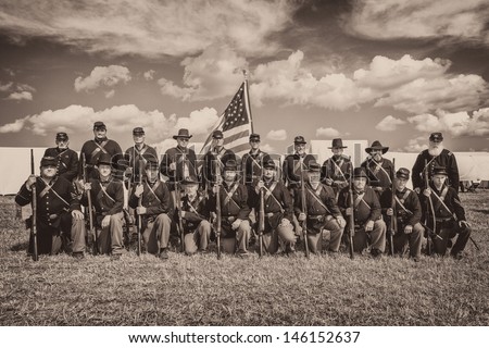 GETTYSBURG, PENNSYLVANIA - JULY 5: Union soldiers pose for a group photo at the reenactment commemorating the 150th anniversary of the Civil War battles on July 5, 2013 in Gettysburg, Pennsylvania