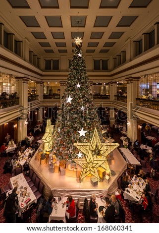 CHICAGO, ILLINOIS - DECEMBER 18, 2013: The Great Tree in the Walnut Room of Macy\'s on State Street on December 18, 2013 in Chicago, Illinois