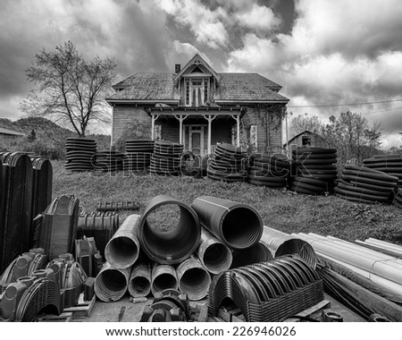 ROAN MOUNTAIN, TENNESSEE- OCTOBER 18: Rundown house with hoses in front yard on October 18, 2014 in Roan Mountain, Tennessee